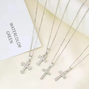 Silver cross pendant necklace set with sparkling zircons on elegant O-chain for women