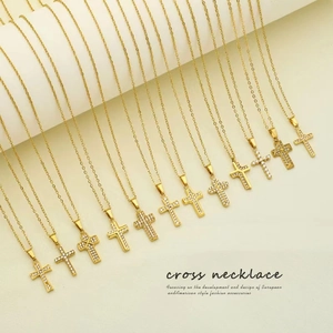 Golden cross necklace with sparkling cubic zirconia on delicate chain for women