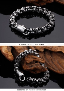 Detail of gothic stainless steel skull link bracelet featuring a large magnetic clasp