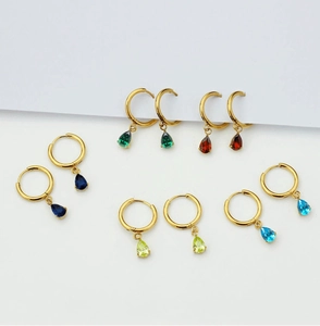 Detailed set of gold titanium steel hoop earrings with colorful pear-cut zircon drops