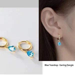 Elegant gold-tone teardrop zircon earrings for women featuring light blue pear-cut stones