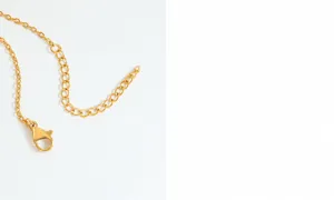 Detailed view of the golden lobster clasp and adjustable extension chain on necklace