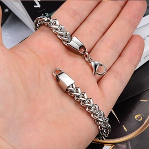 Detailed close-up of wheat link bracelet with lobster clasp and high polished finish