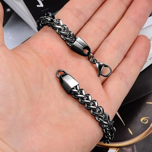 Close-up of black stainless steel wheat link bracelet with a sturdy lobster clasp