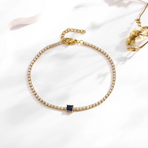 Gold plated tennis bracelet with sparkling cubic zirconia and a blue square gemstone center
