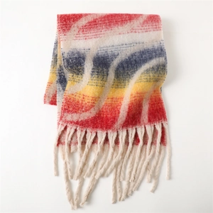 Close-up of rainbow striped cashmere scarf with thick knit texture and white fringe