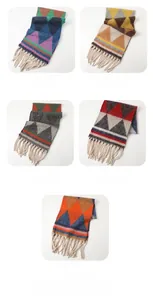 Detail of colorful geometric knit scarves with tassel edges in various colorways