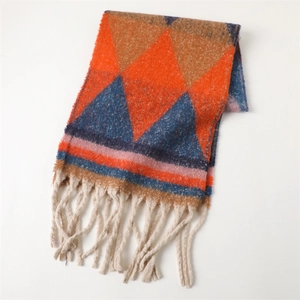 Detail of color-block geometric scarf with soft cashmere-like texture and long fringes