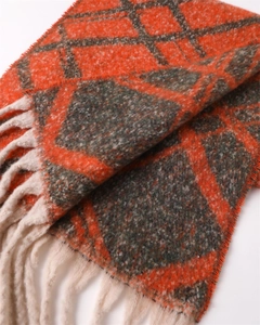 Detailed macro shot of thick plaid scarf texture with white long tassel fringe details