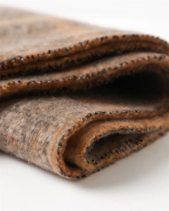 Macro shot of classic plaid scarf texture with thick cashmere-like wool and fringe detail