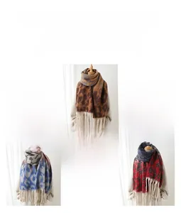 Detail of colorful leopard print scarves with thick fringes in multiple color variants