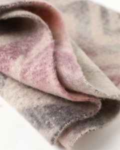 Close-up of thick cashmere-like scarf showing zigzag patterns and soft fiber texture