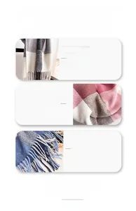 Gros plan sur le tissu doux d'écharpe à carreaux avec franges fines et texture tissée