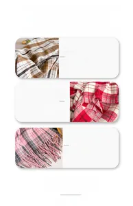 Detail of wool-rich plaid scarf showing soft texture and delicate fringe trim