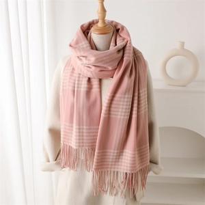 Pink and white plaid cashmere-like scarf with tassels paired with white coat