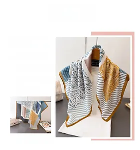 Macro detail of geometric color block scarf with herringbone texture and contrast borders
