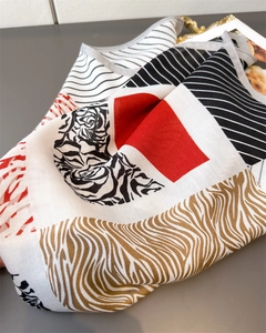 Detail of geometric and zebra print silk-like scarf with red and black color block pattern
