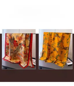 Detail of premium landscape print silk scarf and floral patterned luxury shawl wrap