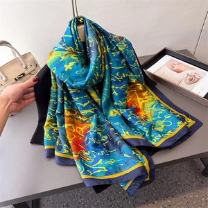 Artistic Xiangyun silk shawl with blue and orange calligraphy prints for sun protection