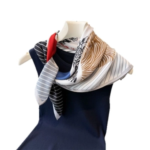 Geometric color-block silk scarf featuring herringbone patterns and floral animal prints