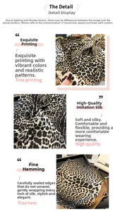 Detailed view of leopard print faux silk scarf showing fine texture and hemmed edges