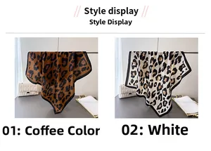Detail of leopard print silk scarves in coffee and white with black contrast borders