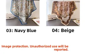 Detail view of navy blue and beige floral paisley patterned silk scarves with elegant texture