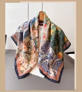 Detail of silk scarf with impressionist floral and blue paisley patterns on hanger