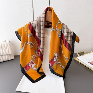 Elegant horsebit chain print silk scarf with orange and beige geometric patterns