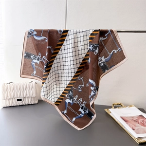Classic equestrian pattern silk scarf with horsebits and chains in deep brown tones