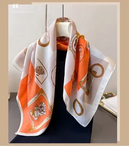 Detailed view of retro herringbone silk scarf with vintage cameos and elegant motifs