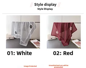 Detail of polka dot and rose pattern square silk scarves in red and white colors