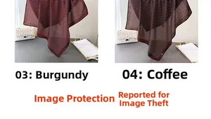 Detailed close-up of burgundy and brown polka dot scarves with refined stitched edges