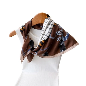 Brown equestrian print silk scarf with horsebit and chain patterns on white base