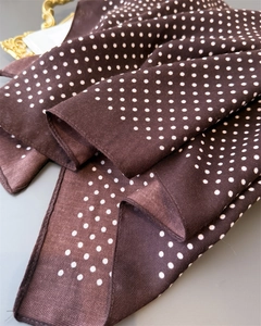 Detail of dark brown silk square scarf with white polka dots and herringbone texture