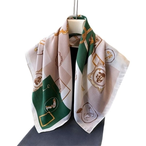 Retro equestrian style silk scarf with green and beige horse pattern on hanger