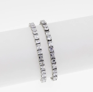 Elegant silver tennis bracelet set with high-clarity cubic zirconia on a white background