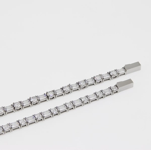 Tennis bracelet in silver finish with alternating square and round cubic zirconia stones