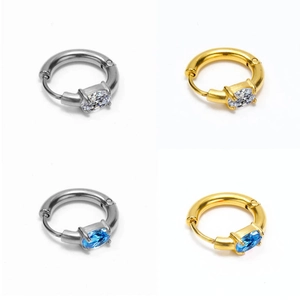 Oval zircon earrings in gold and silver finish featuring blue and white gemstones