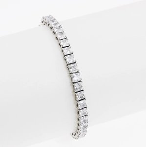 Elegant silver tennis bracelet with single row square cut cubic zirconia on white stand