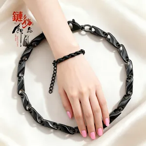Ensemble bracelet et collier à maillons noirs en acier inoxydable sur soie