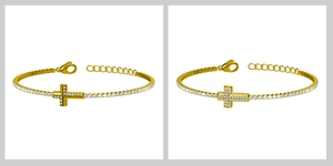 Détail de bracelets croix dorés ornés de zircons micropavés sur des chaînes style tennis