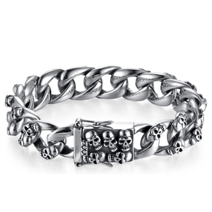 Silver stainless steel Cuban chain bracelet with 3D skull details on a punk rock band
