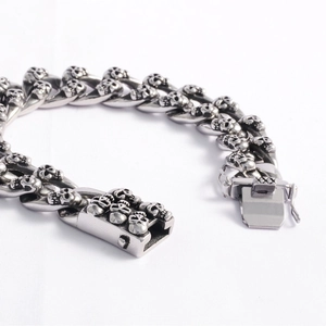 Punk style stainless steel Cuban chain bracelet with double row skull links for men