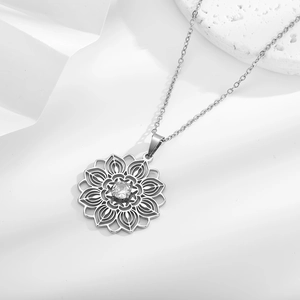 Ethnic style silver necklace with a hollow lotus flower pendant and cubic zirconia