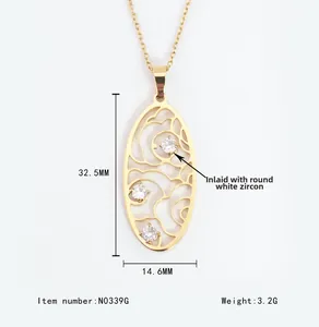 Detail of vintage gold oval hollow pendant with cubic zirconia, 32.5mm by 14.6mm size