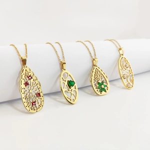 Gold hollowed pendant necklaces with colorful zircon stones on white display stands