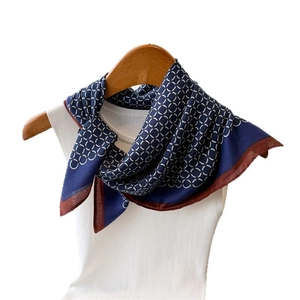 Blue and brown geometric pattern square scarf tied on a hanger for a stylish look