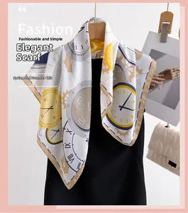 Detail of silk-feel scarf with vintage clock print and dark rolled edges on black garment