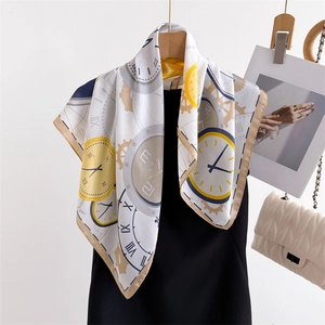 Silk-like satin scarf with vintage clock and gear patterns draped over a black dress